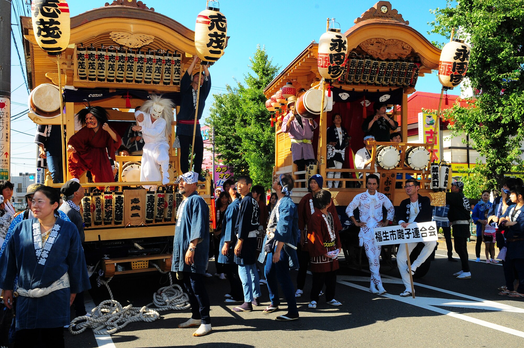 YOKOTA AIR BASE, Japan -- Various performers dress up in costumes to sing and dance during the Fussa Tanabata Festival Aug. 6. The festival itself featured a number of different groups carrying Mikoshi (shrines) and mobile stages featuring performances of traditional Japanese characters such as a fox and an Oni, or a demon. At many points during the march the groups would raise the shrines and cheer in front of the stages. The festival included performances of traditional Japanese dancing and the carrying of Shrines from Shinmeisya Shrine to Fussa City Hall. (U.S. Air Force photo/Staff Sgt. Stacy Moless)

