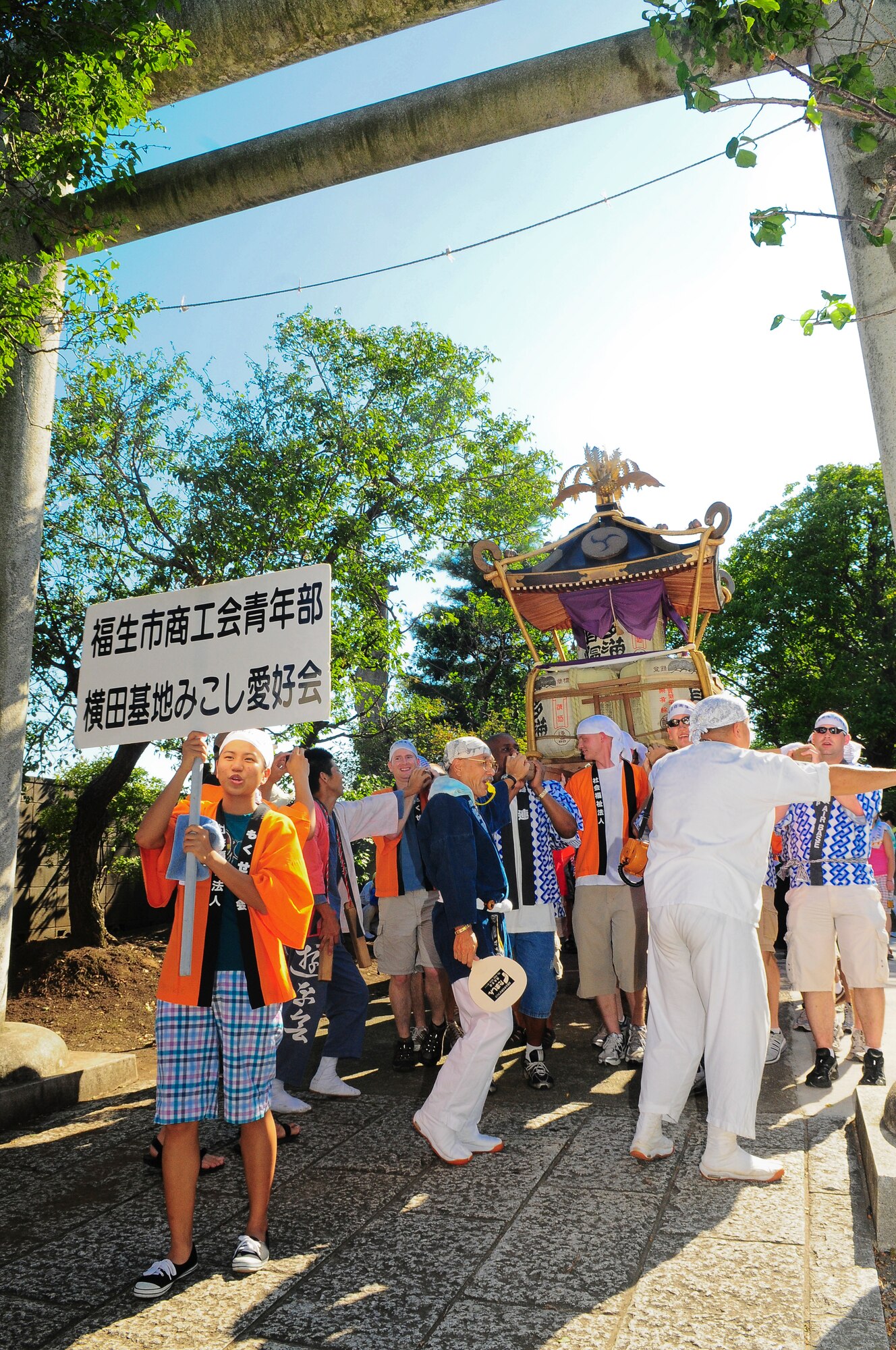 YOKOTA AIR BASE, Japan -- Military Members from Yokota Air Base, Japan participated in the Fussa City Tanabata Festival Aug. 6. The festival itself featured a number of different groups carrying Mikoshi (shrines) and mobile stages featuring performances of traditional Japanese characters such as a fox and an Oni, or a demon. At many points during the march the groups would raise the shrines and cheer in front of the stages. The festival included performances of traditional Japanese dancing and the carrying of shrines from Shinmeisya Shrine to Fussa City Hall. (U.S. Air Force photo/Staff Sgt. Stacy Moless)
