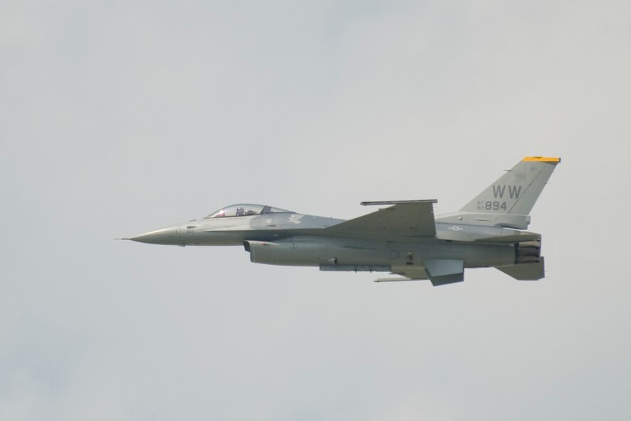 MISAWA AIR BASE, Japan -- Capt. Jeffrey Schneider, Pacific Air Forces F-16 demonstration team pilot, performs aerial maneuvers for children from the Hirosaki Aiseien orphanage during Friendship Day Aug. 5. The PACAF F-16 demo team put on a show for 32 children to promote cultural exchange between the U.S. and Japan. (U.S. Air Force photo/Senior Airman Jamal D. Sutter)