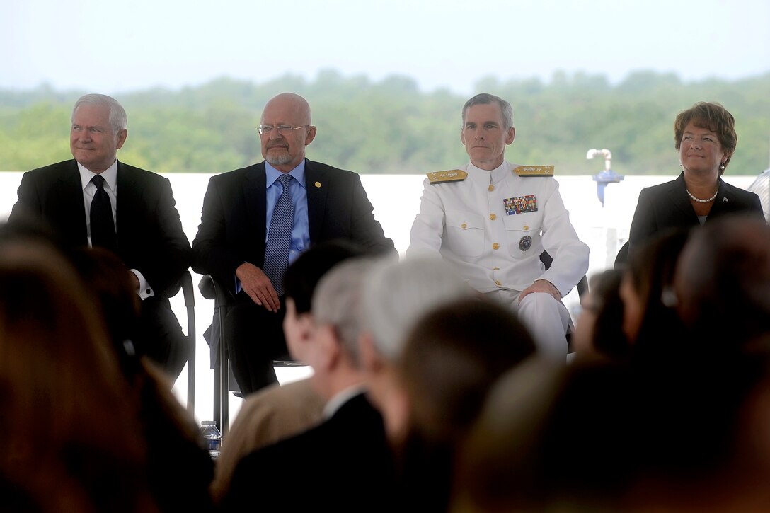 Left to right, Defense Secretary Robert M. Gates, James R. Clapper Jr., the Director of National Intelligence, Navy Vice Adm. Robert B. Murrett, outgoing director of the Geospatial-Intelligence Agency, and Letitia Long, the agency's incoming director, participate in a ceremony to mark the changing of directors at the agency's new east campus in Springfield, Va., Aug. 9, 2010.
