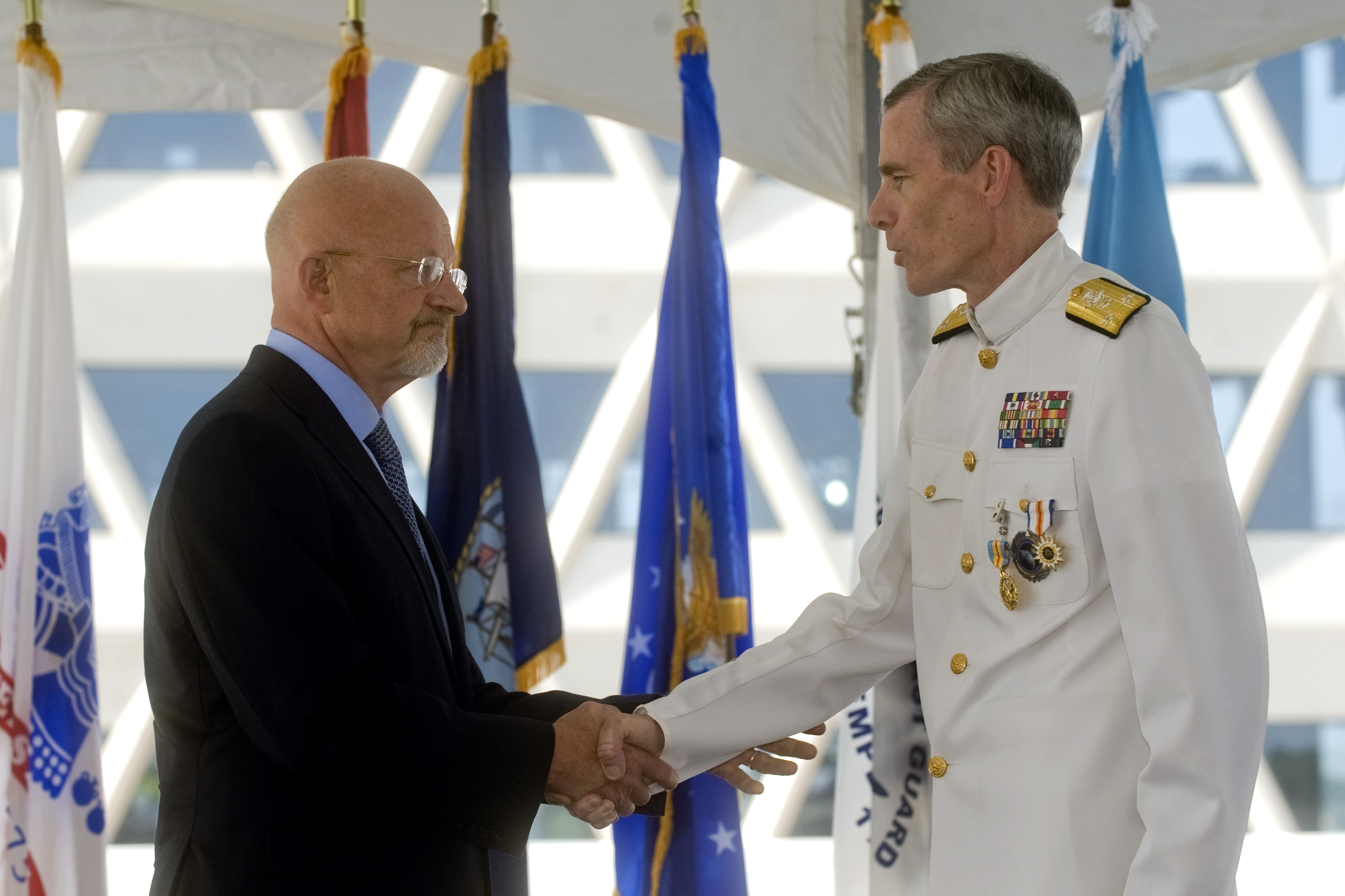 James R. Clapper Jr., left, the Director of National Intelligence ...