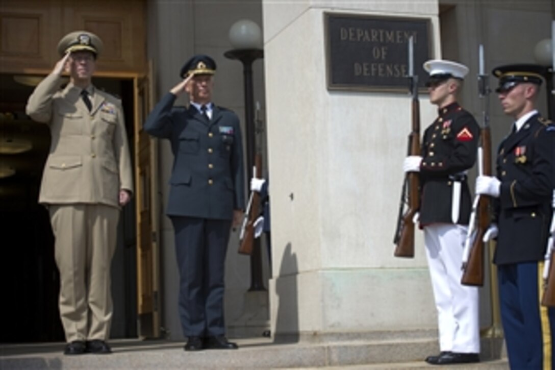 Chairman of the Joint Chiefs of Staff Adm. Mike Mullen, U.S. Navy, welcomes Supreme Commander of the Swedish Armed Forces Gen. Sverker Goranson to the Pentagon on Aug. 5, 2010.  