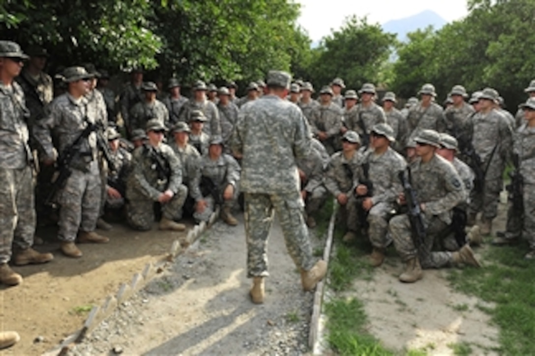Commander of the International Security Assistance Force Gen. David H. Petraeus (center), U.S. Army, talks with U.S. soldiers of the 2nd Battalion, 327th Infantry Regiment, 1st Brigade Combat Team, 101st Airborne Division at Combat Outpost Monti in eastern Afghanistan on Aug. 5, 2010.  