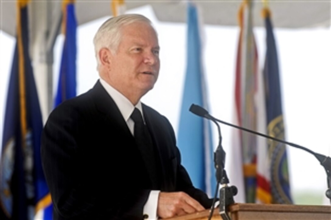 Defense Secretary Robert M. Gates addresses the audience during the National Geospatial-Intelligence Agency ceremony to mark the changing of directors at the agency's new east campus in Springfield, Va., Aug. 9, 2010. Navy Vice Adm. Robert B. Murrett relinquished command to Letitia Long, the first female to head a U.S. intelligence agency.