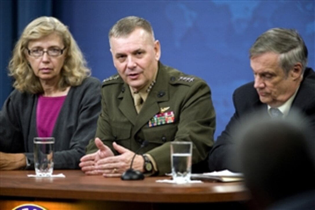 Christine H. Fox, director of cost assessment and program evaluation, Marine Corps Gen. James E. Cartwright Jr., vice chairman of the Joint Chiefs of Staff, and Robert F. Hale, undersecretary of defense and comptroller, answer questions from the press following Defense Secretary Robert M. Gates' press conference at the Pentagon, Aug. 9, 2010.  