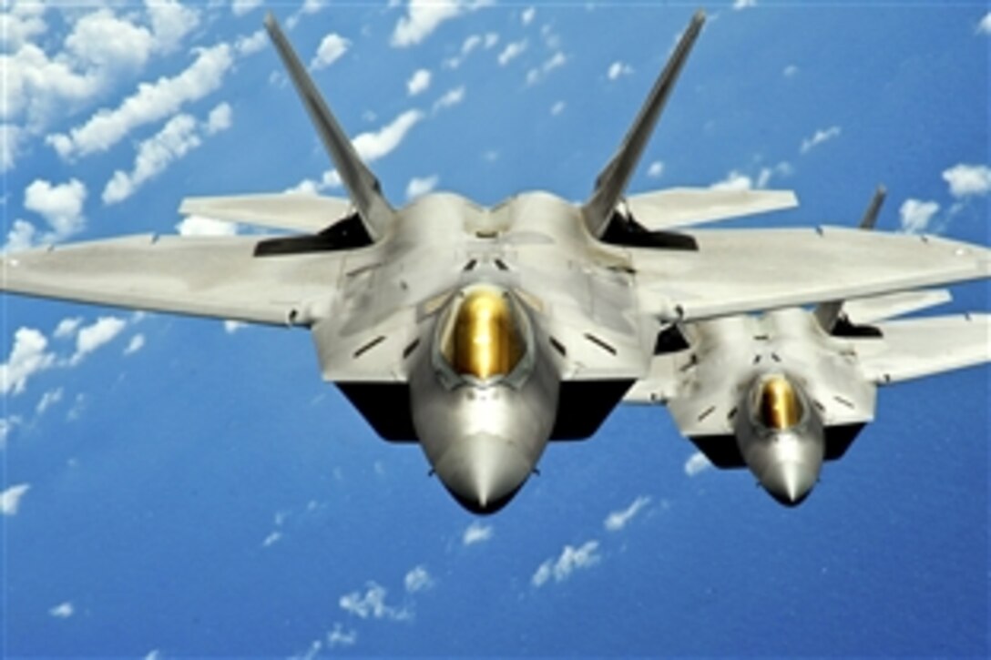 U.S. Air Force airmen complete the first accelerated maintenance plan on an F-22 Raptor in a deployed environment on Andersen Air Force Base, Guam, Aug. 4, 2010. The airmen are assigned to the  27th Expeditionary Aircraft Maintenance Unit, which had 10 days to complete a process that normally takes up to a month.