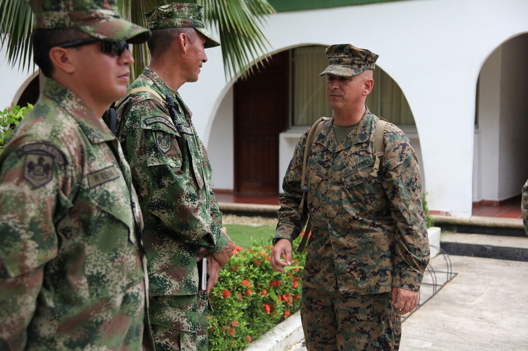 Sgt. Maj. William R. Sweet, sergeant major of Special-Purpose Marine Air-Ground Task Force Continuing Promise 2010, talks to Colombian Marines at Colombian Marine Corps Training Base Covenas in Colombia, Aug. 10, 2010. The Marines’ mission of CP10 is to conduct civil-military operations including subject matter expert exchanges, humanitarian civic assistance and disaster relief response to partner nations in the Caribbean, Central and South America. (Marine Corps photo by Cpl. Alicia R. Giron)