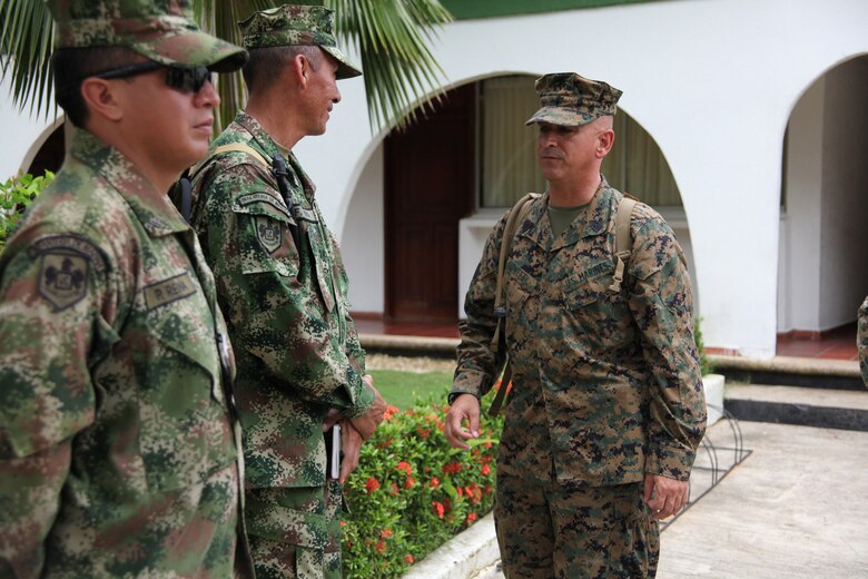 Sgt. Maj. William R. Sweet, sergeant major of Special-Purpose Marine Air-Ground Task Force Continuing Promise 2010, talks to Colombian Marines at Colombian Marine Corps Training Base Covenas in Colombia, Aug. 10, 2010. The Marines’ mission of CP10 is to conduct civil-military operations including subject matter expert exchanges, humanitarian civic assistance and disaster relief response to partner nations in the Caribbean, Central and South America. (Marine Corps photo by Cpl. Alicia R. Giron)