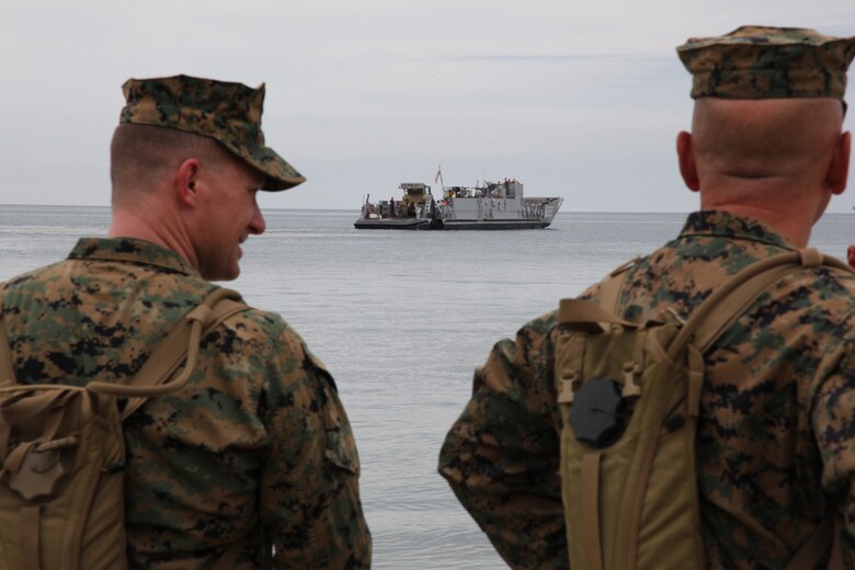 (From left) Lt. Col. Chris S. Richie, commanding officer of Special-Purpose Marine Air-Ground Task Force Continuing Promise 2010, and Sgt. Maj. William R. Sweet, sergeant major of Special-Purpose MAGTF, observe  a landing craft utility make way to the USS Iwo Jima in Covenas, Colombia, Aug. 10, 2010. The mission of CP10 is to conduct civil-military operations including subject matter expert exchanges, humanitarian civic assistance and disaster relief to partner nations to the Caribbean, Central and South America. (Marine Corps photo by Cpl. Alicia R. Giron)