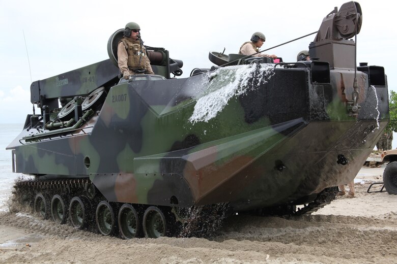 Marines with Company A, 2nd Assault Amphibian Battalion, Ground Combat Element of Special-Purpose Marine Air-Ground Task Force, Continuing Promise 2010, maneuver an amphibious assault vehicle onto a beach in Covenas, Colombia, Aug. 10, 2010, in preparation for subject matter expert exchanges with Colombian Marines. The mission of CP10 is to conduct civil-military operations including subject matter expert exchanges, humanitarian civic assistance and disaster relief to partner nations to the Caribbean, Central and South America. (Marine Corps photo by Cpl. Alicia R. Giron)