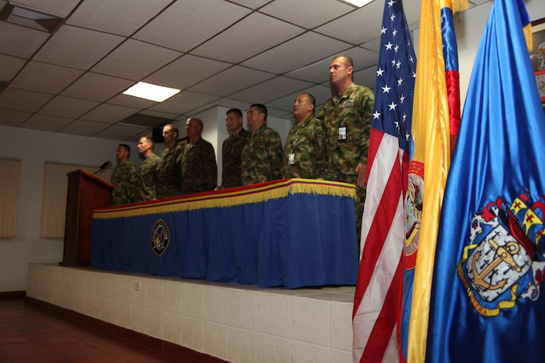 U.S. and Colombian Marines stand at the playing of the Marines’ hymn during an opening ceremony at Colombian Marine Corps Training Base Covenas in Colombia, Aug. 10, 2010, as the start of joint military subject matter expert exchanges with Colombian and U.S. Marines as part of Continuing Promise 2010. The mission of CP10 is to conduct civil-military operations including subject matter expert exchanges, humanitarian civic assistance and disaster relief to partner nations to the Caribbean, Central and South America. (Marine Corps photo by Cpl. Alicia R. Giron)