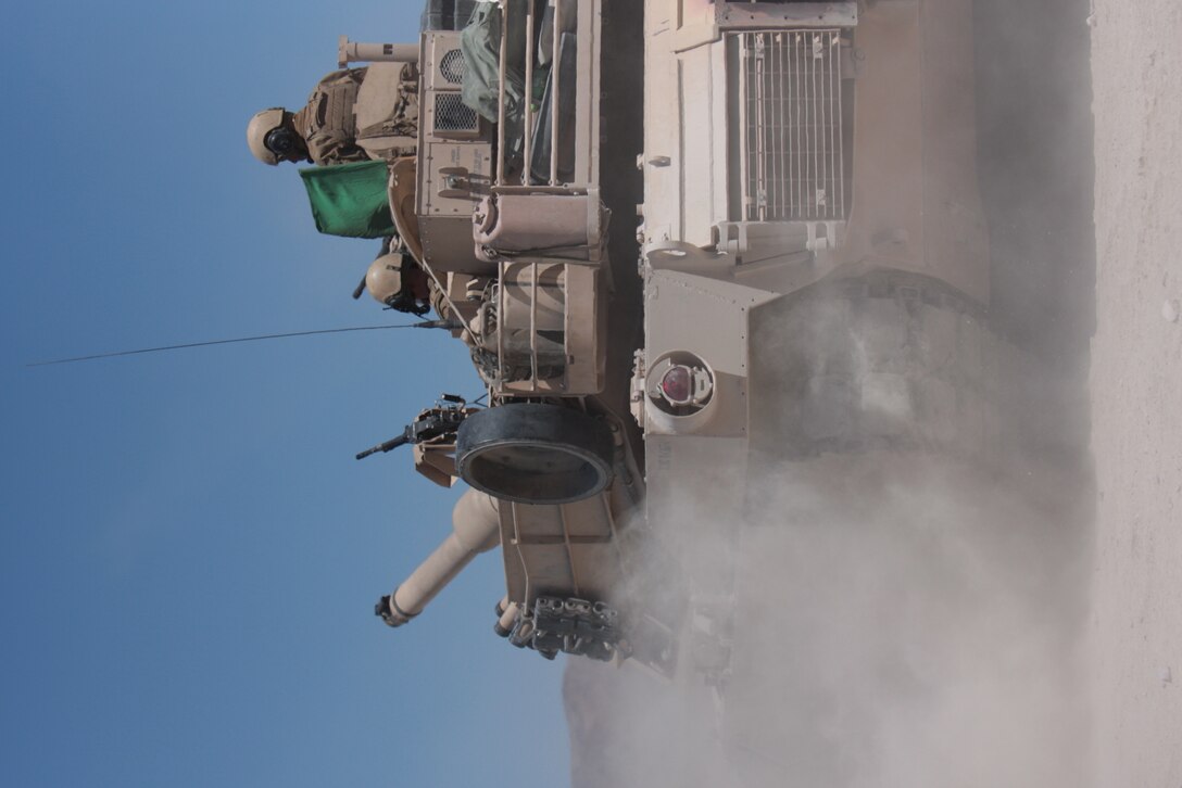 Tanks line up for a long range engagement of enemy tanks during 1st Platoon, Company D, 1st Tank Battalion’s first gunnery qualification Aug. 10 at Combat Center range 500. The platoon was formed in May and consists of many new Marines and tank crews who are still learning to work together, said Sgt. Kip Huhman, a tank commander in the platoon.