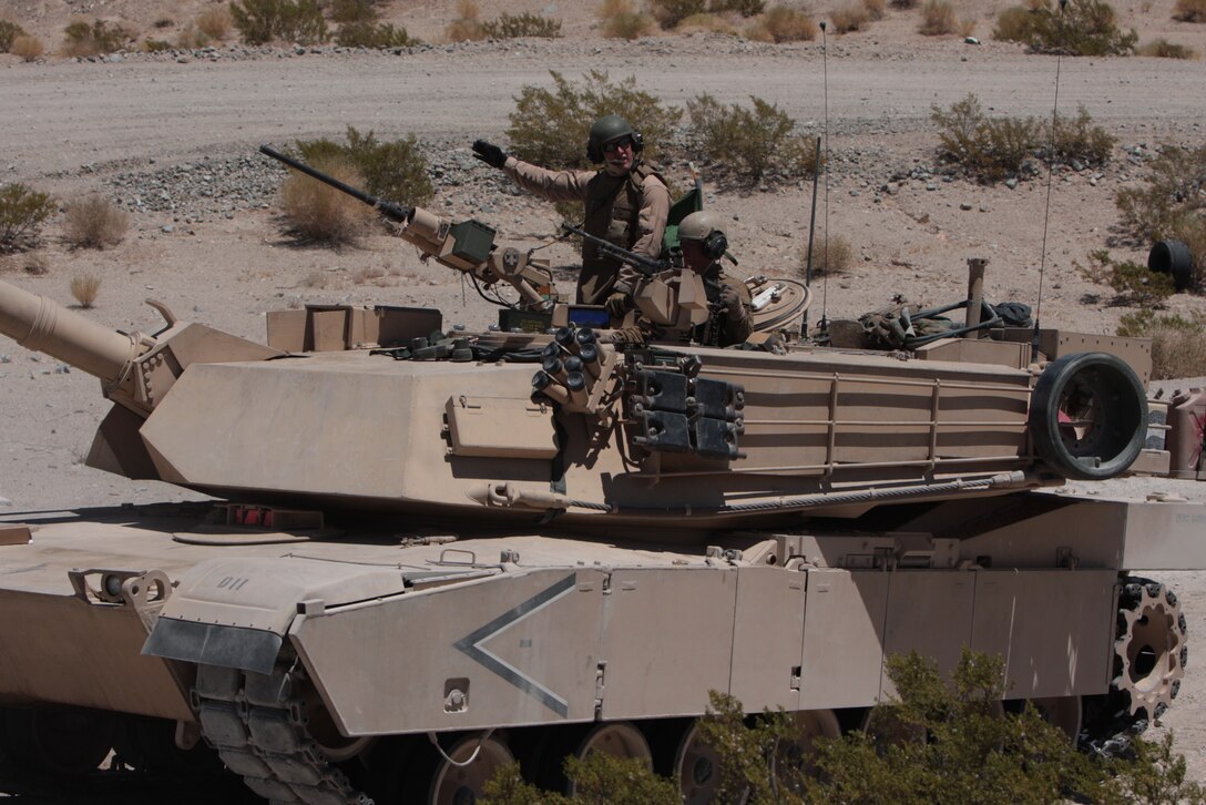 Tankers with 1st Platoon, Company D, 1st Tank Battalion, wait to take part in their first scenario Aug. 10 during the platoon’s first gunnery qualification exercise at Combat Center range 500.