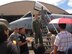 Capt. James Darlson, 25th Fighter Squadron A-10 pilot, and Senior Airman Darren Nam, AFOC personnel directorate, briefs families on the A-10 capabilities August 6.  Senior Airman Kevin Benberry (on the stairs), a 51st Maintenance Group weapons loader, assists with the A-10 tour.  (U.S. Air Force photo by Maj. Denise Kerr)