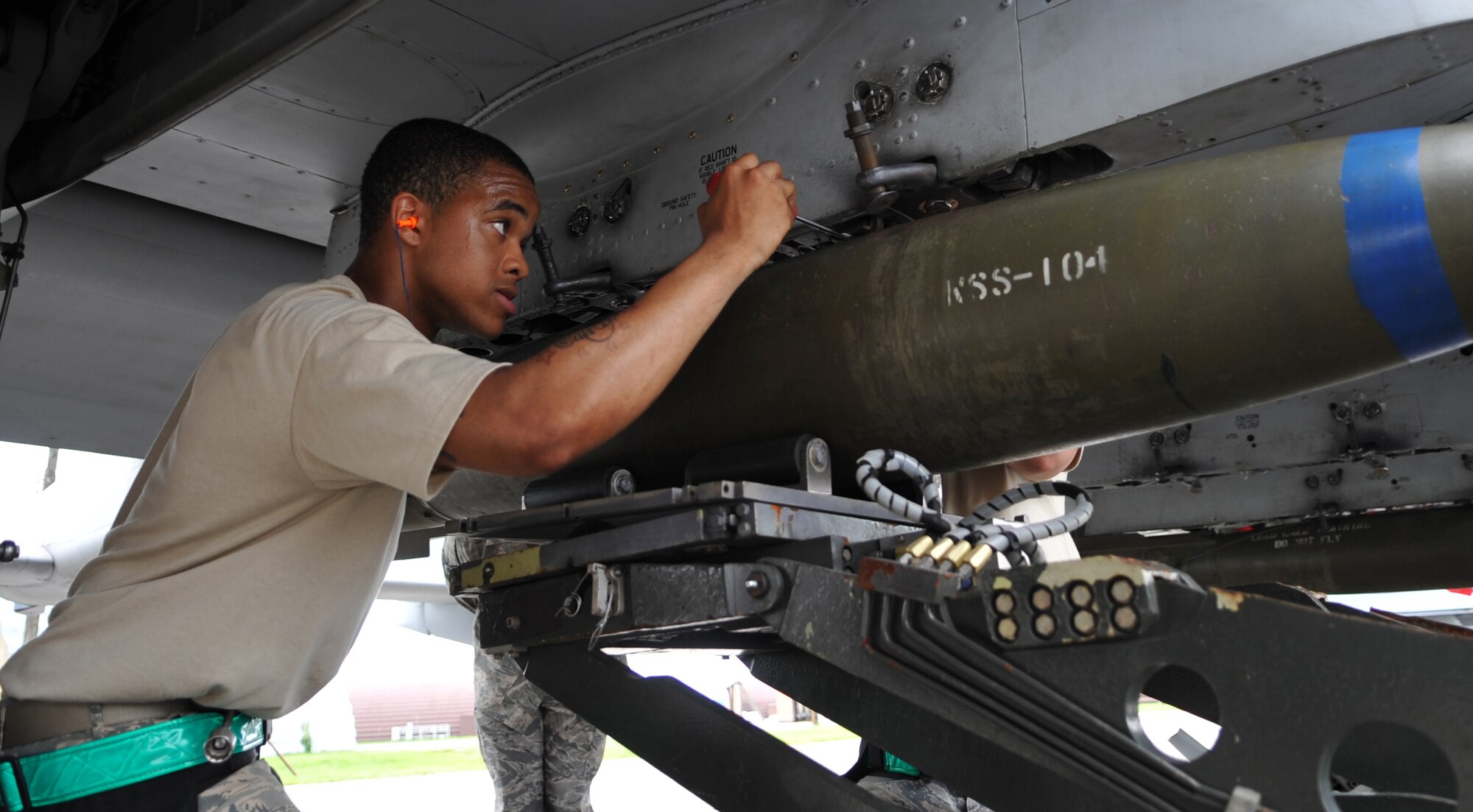 Senior Airman Adrian Collins, 51st Aircraft Maintenance Squadron, preps an A-10 in the quarterly weapons load crew competition at Osan Air Base, Republic of Korea, Aug. 6. Airman Collins and his weapons load team won the competition. (U.S. Air Force Photo/Senior Airman Evelyn Chavez)
