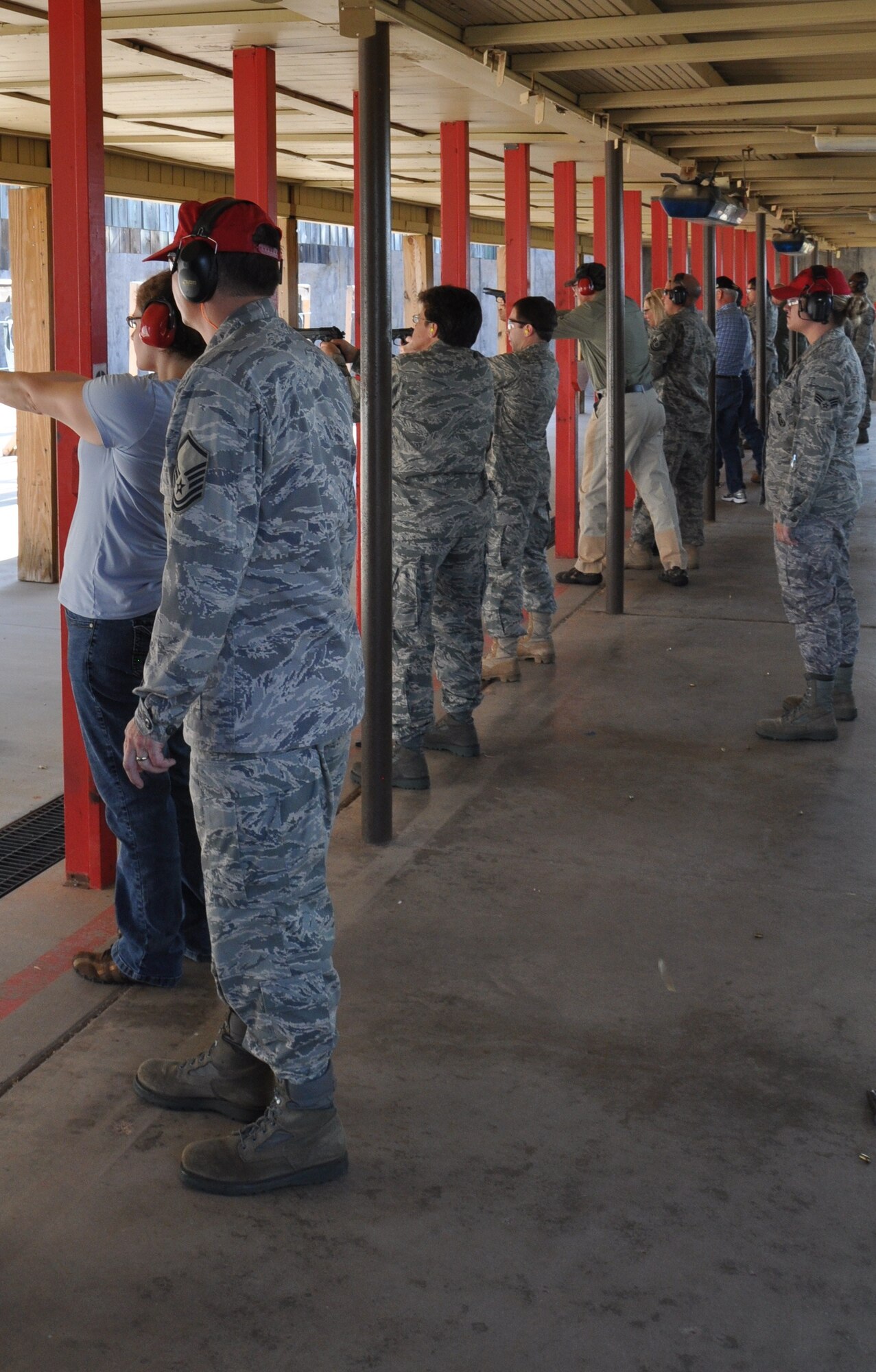 Commanders and Squadron Adopter Program sponsors shoot M9s at the Commander’s Shoot event at Sheppard Air Force Base, Texas, Aug. 6. The commanders and sponsors were invited to the event where they were given a weapon safety brief before they shot the M9 and later the M4. After the groups were done firing the weapons, they went to the Heritage Center for a luncheon. (U.S. Air Force photo/Airman 1st Class Adawn Kelsey)  