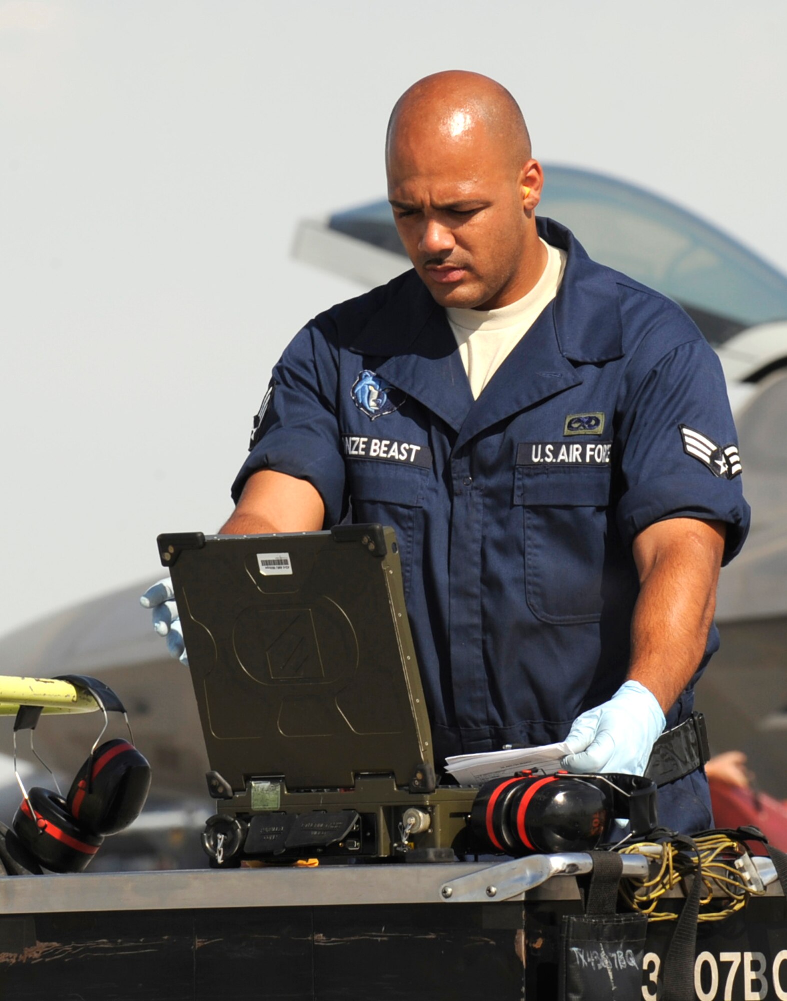 MOUNTAIN HOME AIR FORCE BASE, Idaho -- Senior Airman Dez Watson, 43rd Aircraft Maintenance Unit crew chief out of Tyndall AFB, Fla., updates information to a toughbook on the Mountain Home AFB flightline Aug 6. The airspace and terrain in the local area allows the F-22 to employ air-to-air and air-to-ground capabilities in mountainous areas which greatly differ from the coastal and water areas where they typically conduct their training. (U.S. Air Force photo by Airman 1st Class Debbie Lockhart)