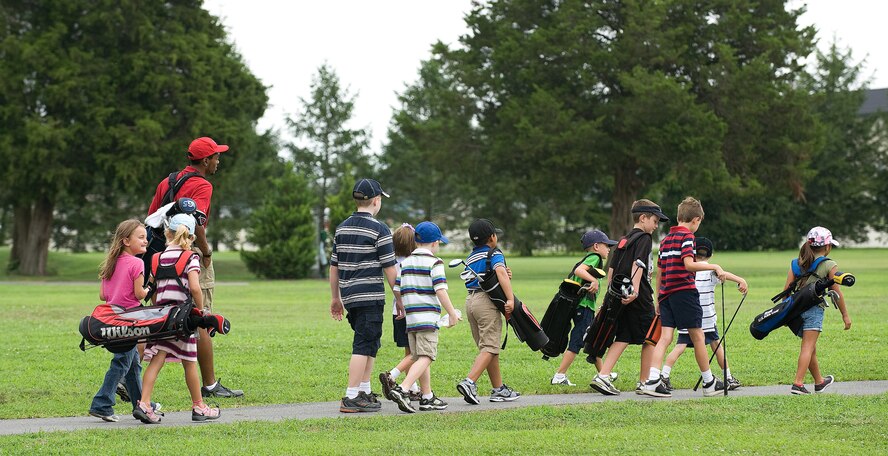 The First Tee of Delaware members make their way to the Dover Air Force Base Eagle Creek golf course July 28, 2010. The First Tee program was initiated to help teach children important life skills through the game of golf. (U.S. Air Force photo by Jason Minto/Released)