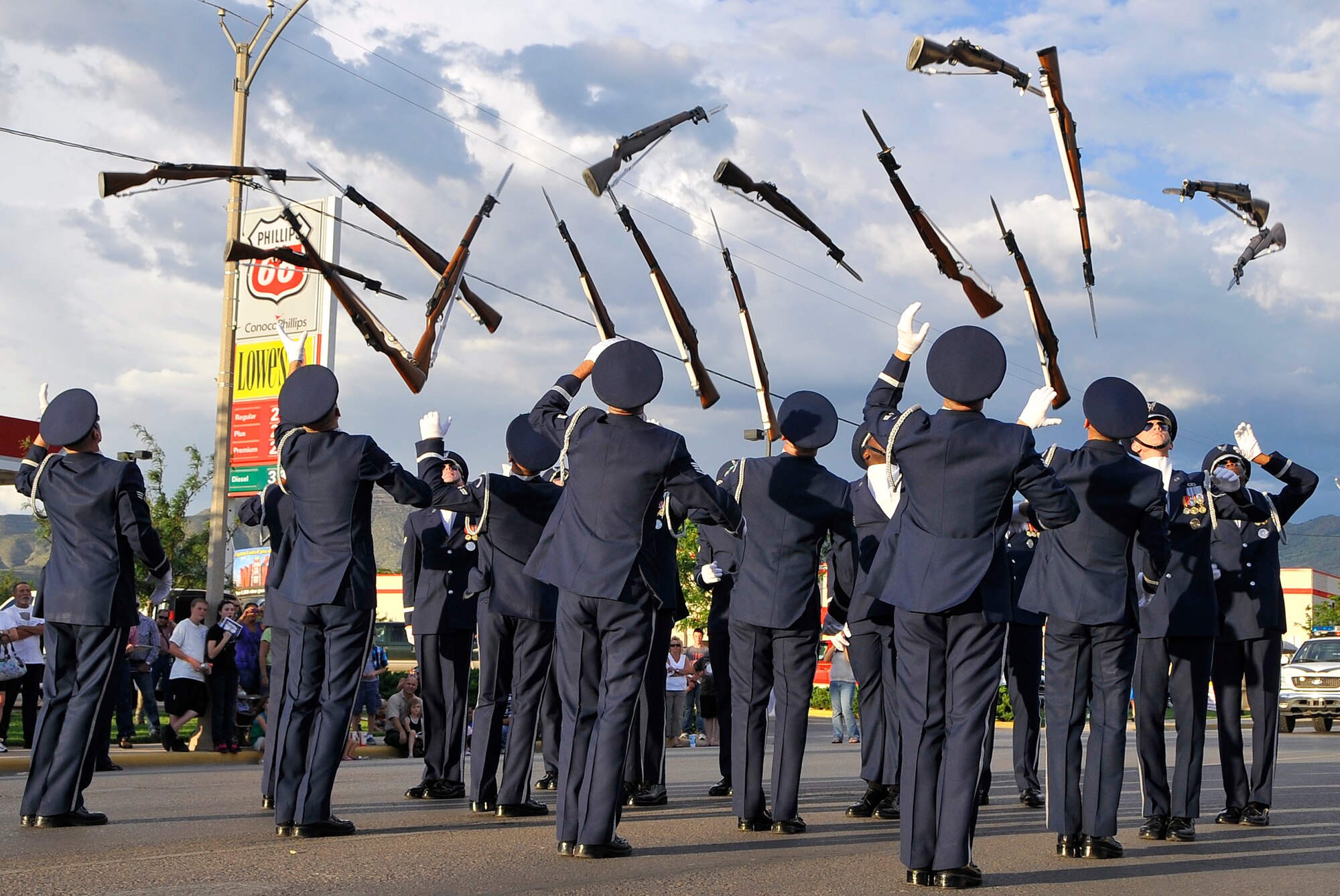 ALAMOGORDO, N.M. -- Members of the Air Force Honor Guard Drill Team perform a 16-man demonstration at the conclusion of the Otero County Fair Parade Aug. 7, 2010. The AF Honor Guard Drill Team is the traveling component of the USAF Honor Guard and inspires Air Force awareness among military and civilian audiences through its complex drill routine. (U.S. Air Force photo by Tech. Sgt. Chris Flahive)