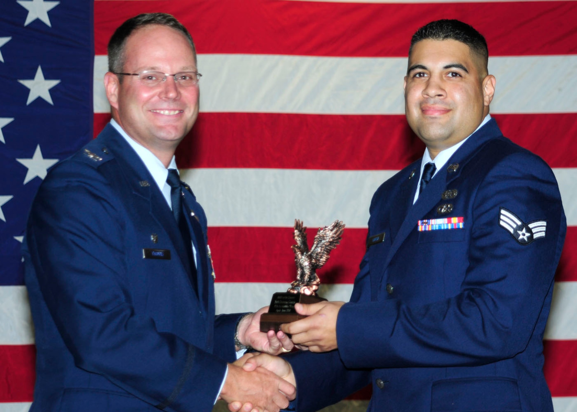 ALTUS AIR FORCE BASE, Okla.-- Senior Airman Dominic Garcia is being awarded Airman of the quarter for the second quarter of 2010 by Col Ty Thomas July 23. (U.S. Air Force photo by / Airman 1st Class Myles Stepp / Released / 97th Air Mobility Wing Public Affairs)