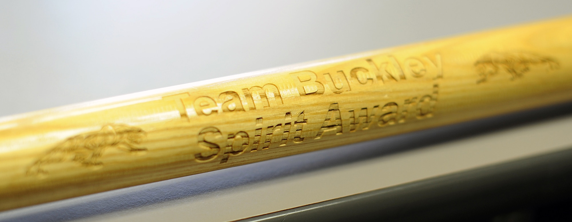 ARPC claimed the Team Buckley Spirit Award, also known as the Spirit Stick, at the Team Buckley Quarterly Awards ceremony July 29. It is the first time ARPC has won the award which is given to the unit whose members show the most enthusiasm and support for their quarterly nominees. (U.S. Air Force photo/Greg Simmonds)