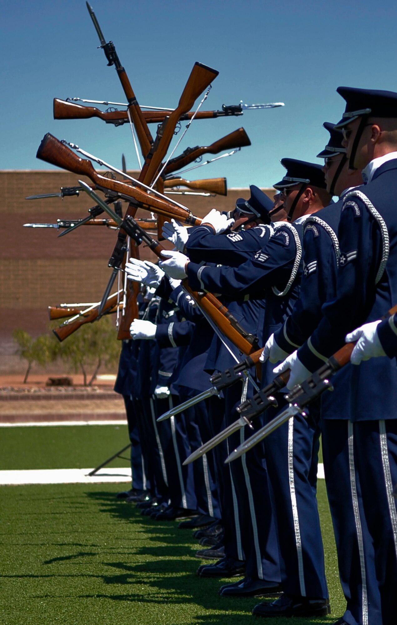 HOLLOMAN AIR FORCE BASE, N.M. -- Sixteen members of the United States Air Force Honor Guard Drill Team perform for Team Holloman Aug. 6, 2010. The drill team inspires Air Force awareness among military and civilian audiences by personifying the precision, discipline, teamwork and professionalism of every Air Force mission.  (U.S. Air Force photo by Airman 1st Class Joshua Turner / Released)