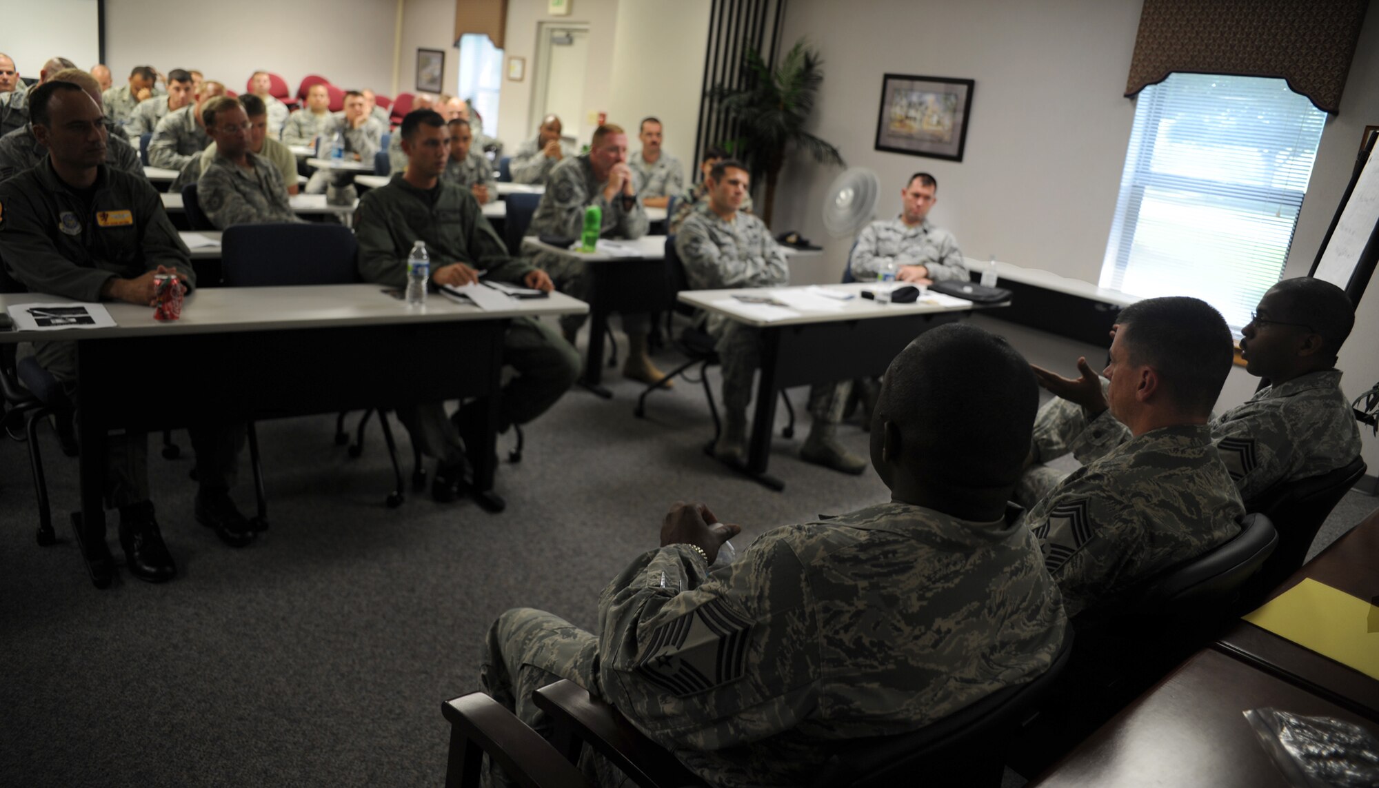 A classroom full of technical sergeants discuss questions and concerns with chief master sergeants at the Airman and Family Readiness Center Aug. 4, 2010, on Joint Base Charleston, S.C. The technical sergeants drilled chiefs with in-depth questions seeking answers and advice from senior noncommissioned officers with experience leading from the top tier of the enlisted force. The question and answer session was held as part of the junior NCOs indoctrination into the senior NCO corps. (U.S. Air Force photo/Senior Airman Timothy Taylor)