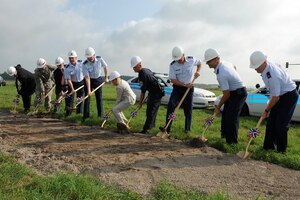 LANGLEY AIR FORCE BASE, Va. - Col. Donald Kirkland, 633d Air Base Wing commander, Lt. Col. Jeffrey Ullmann, 633d Civil Engineer Squadron commander, City of Hampton Mayor Molly Ward, and others perform a ground breaking ceremony Aug. 9. The ceremony was held for a $ 7.2 million state of the art, large vehicle inspection station near the Armistead Gate. (U.S. Air Force photo/Senior Airman Gul Crockett)