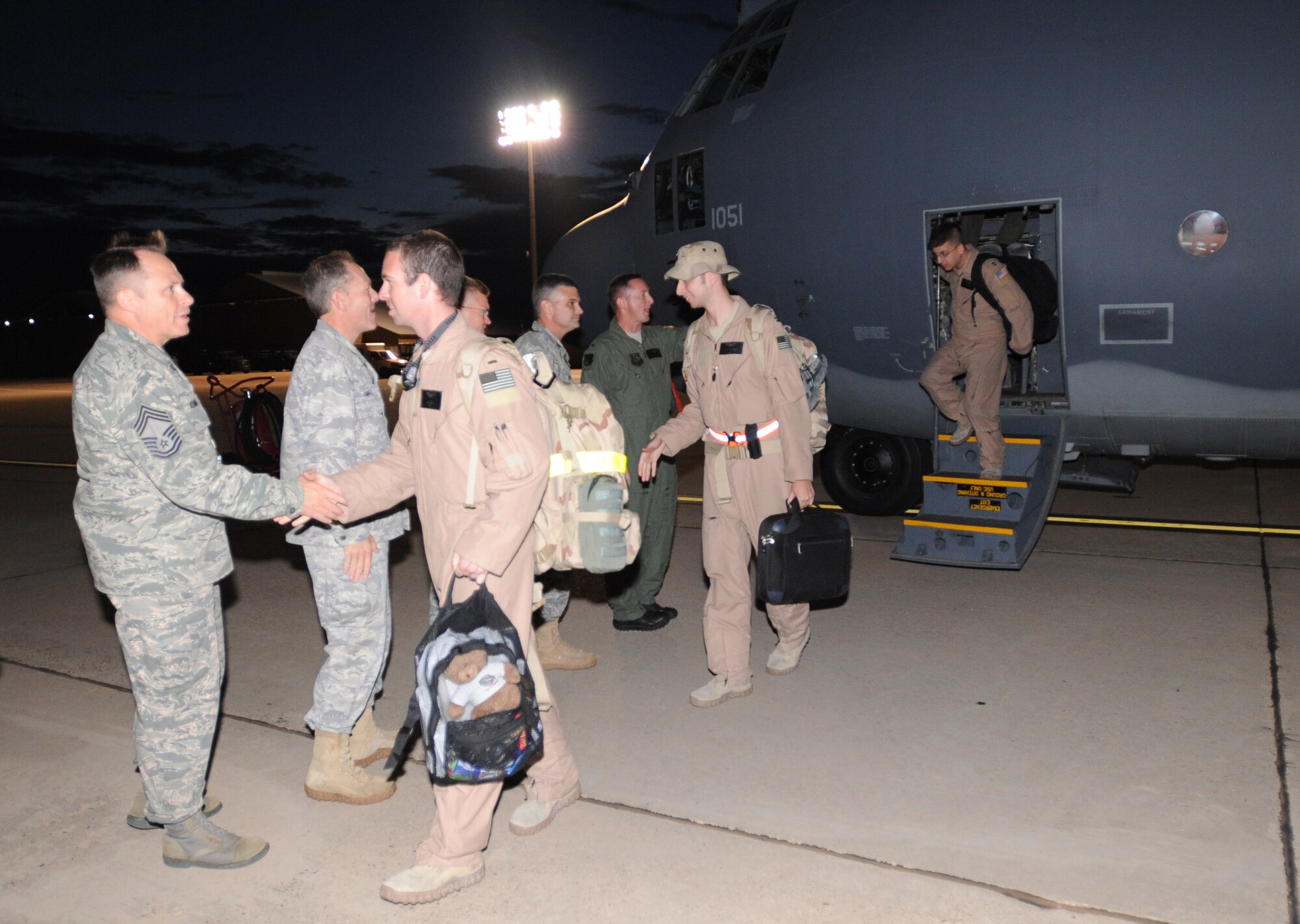 27th Special Operations Wing leadership greets Airmen Aug. 8, 2010, as they return to Cannon Air Force Base, N.M., following their  deployments to Afghanistan. Operation Homecoming welcomed back the Airmen from several Cannon squadrons. (U.S. Air Force photo by Airman 1st Class Maynelinne De La Cruz/Released)
