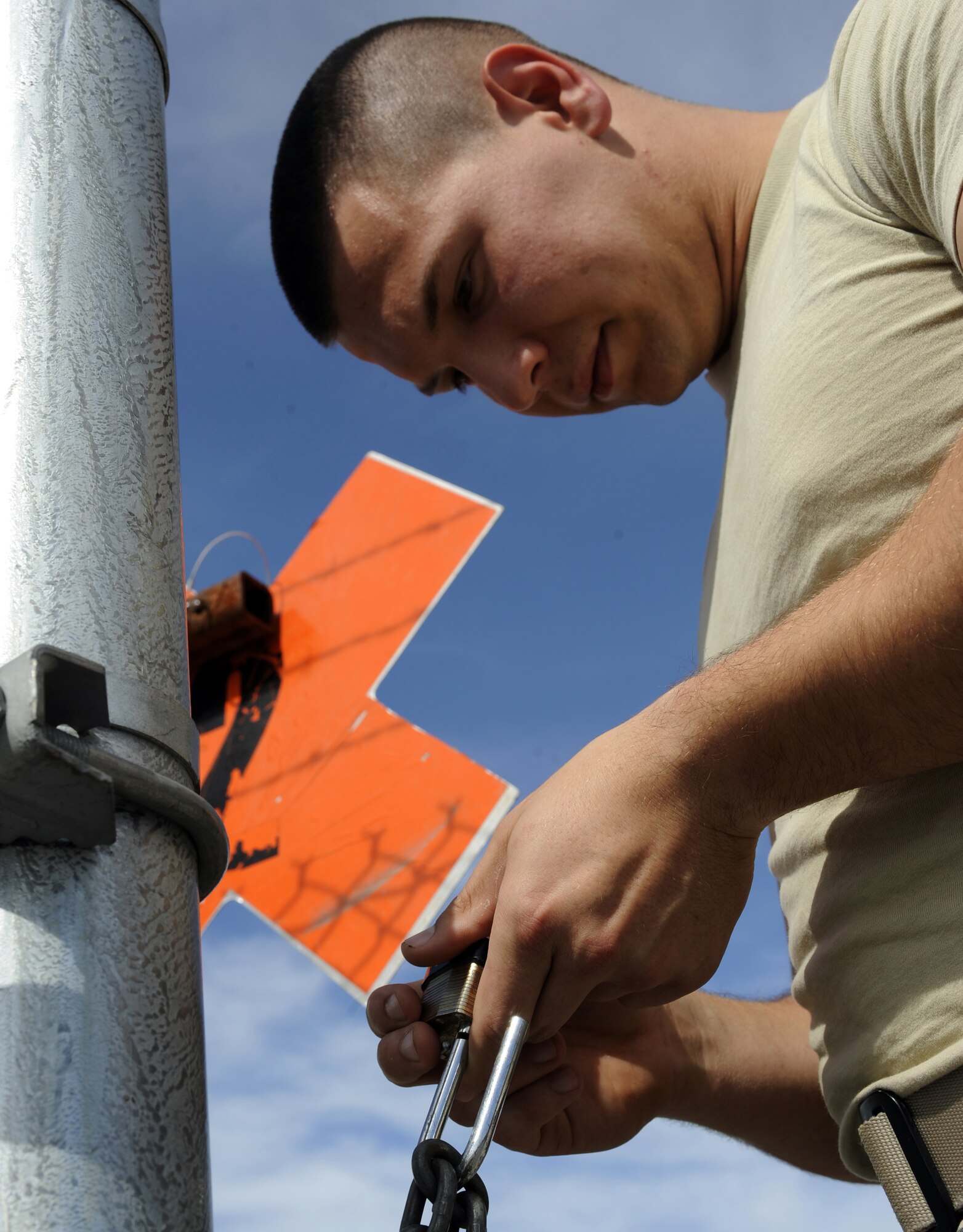 Airman 1st Class Matthew Beall sets a combination August 6, 2010 Eielson Air Force Base, Alaska. Airman Beall performs monthly lock combination changes to ensure the security of munitions. Airman Beall is a munitions storage crewmember assigned to the 354th Munitions Flight. (U.S. Air Force photo/Senior Airman Willard E. Grande II)