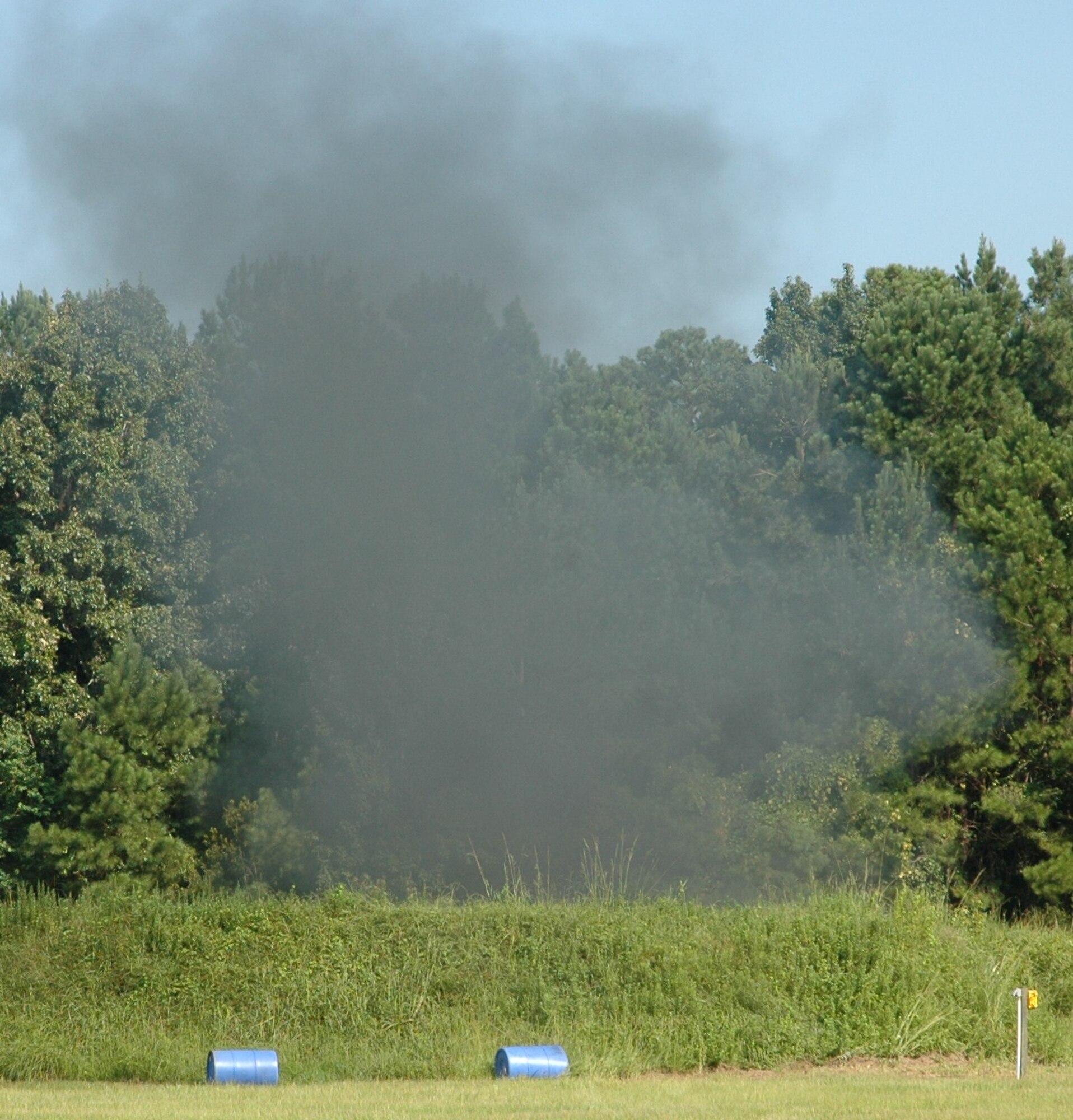 Smoke fills the air when the 315th Civil Engineering Flight, Explosive Ordnance Disposal unit detonate 5 pounds of C4 explosives  August 7, 2010, at Charleston Air Force Base, S.C. (U.S. Air Force photo/Maj. Bill Walsh)
