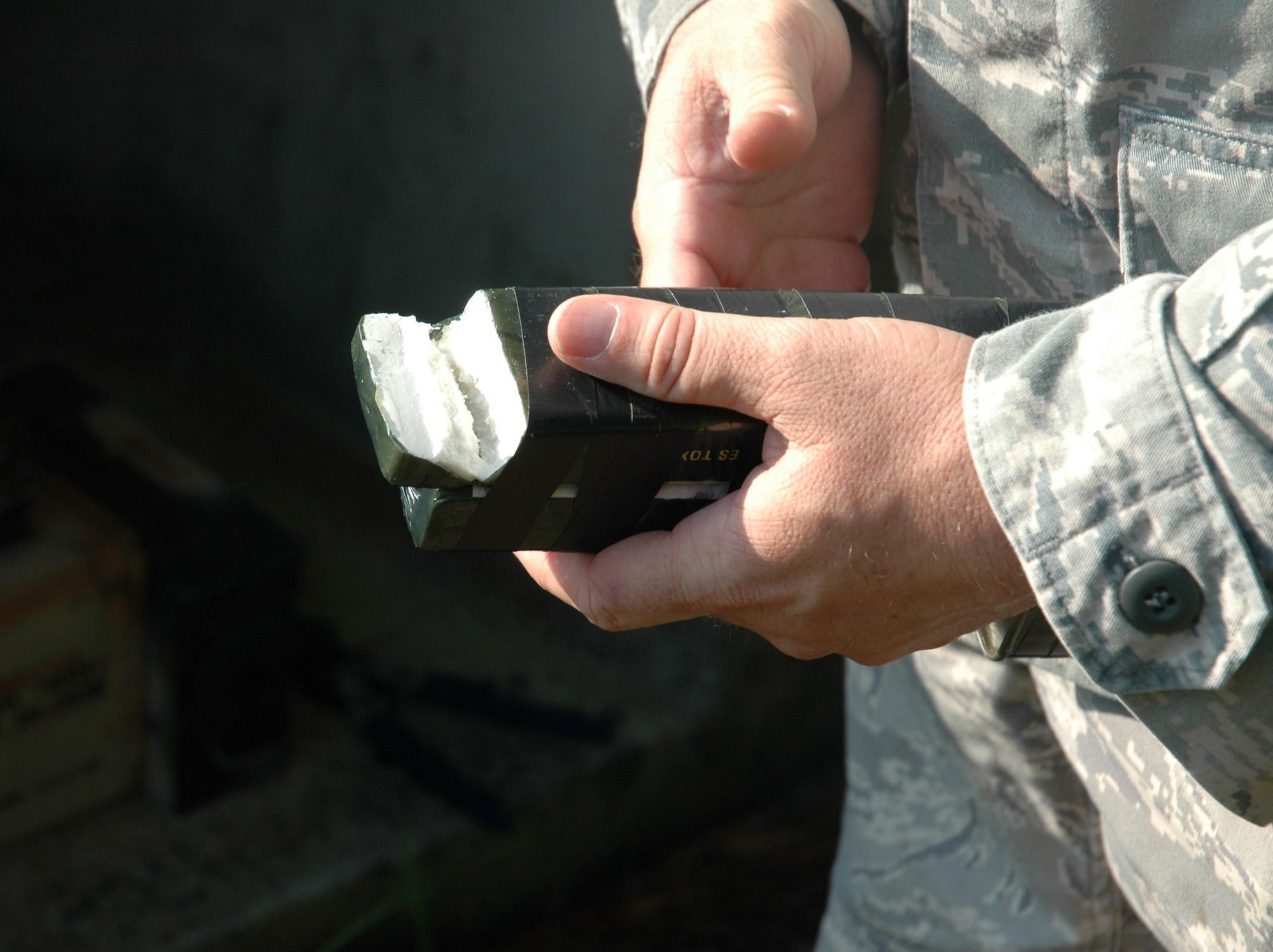 Staff Sgt. Dave Barrett demonstrates the use of C4 explosives August 7, 2010, at Charleston Air Force Base, S.C. Sergeant Barrett is an explosive ordnance disposal technician with the 315th Civil Engineering Flight, Explosive Ordnance Disposal unit. (U.S. Air Force photo/Maj. Bill Walsh)