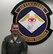 Tech Sgt. Robert Ryan, 14th Weapons Squadron Sensor operator, poses in front of the 14th WPS patch at his squadron's building at Hurlburt Field, Fla. Sergeant Ryan was selected for this week's 