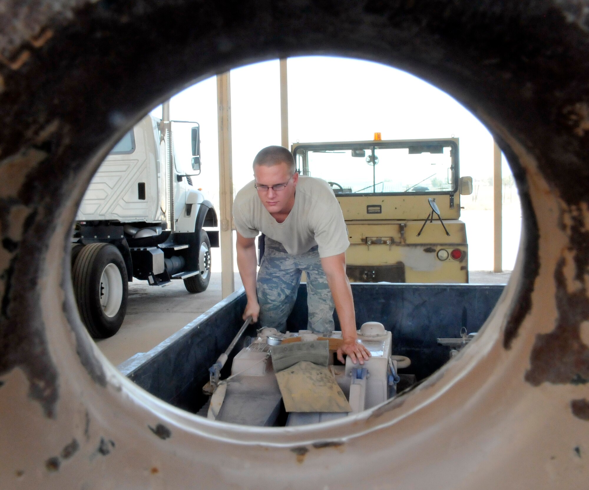 Senior Airman William Davenport, 332 Expeditionary Maintenance Squadron Crash Recovery, Wheel and Tire technician, pumps a wheel skate assembly to ensure serviceability July 9, 2010, Joint Base Balad, Iraq. Wheel skates are used to help tow damaged aircraft from the airfield. Airman Davenport is a native of Trenton. Mich., deployed from McEntyre Joint National Guard Base, S.C. (U.S. Air Force photo/ Staff Sgt. Phillip Butterfield)