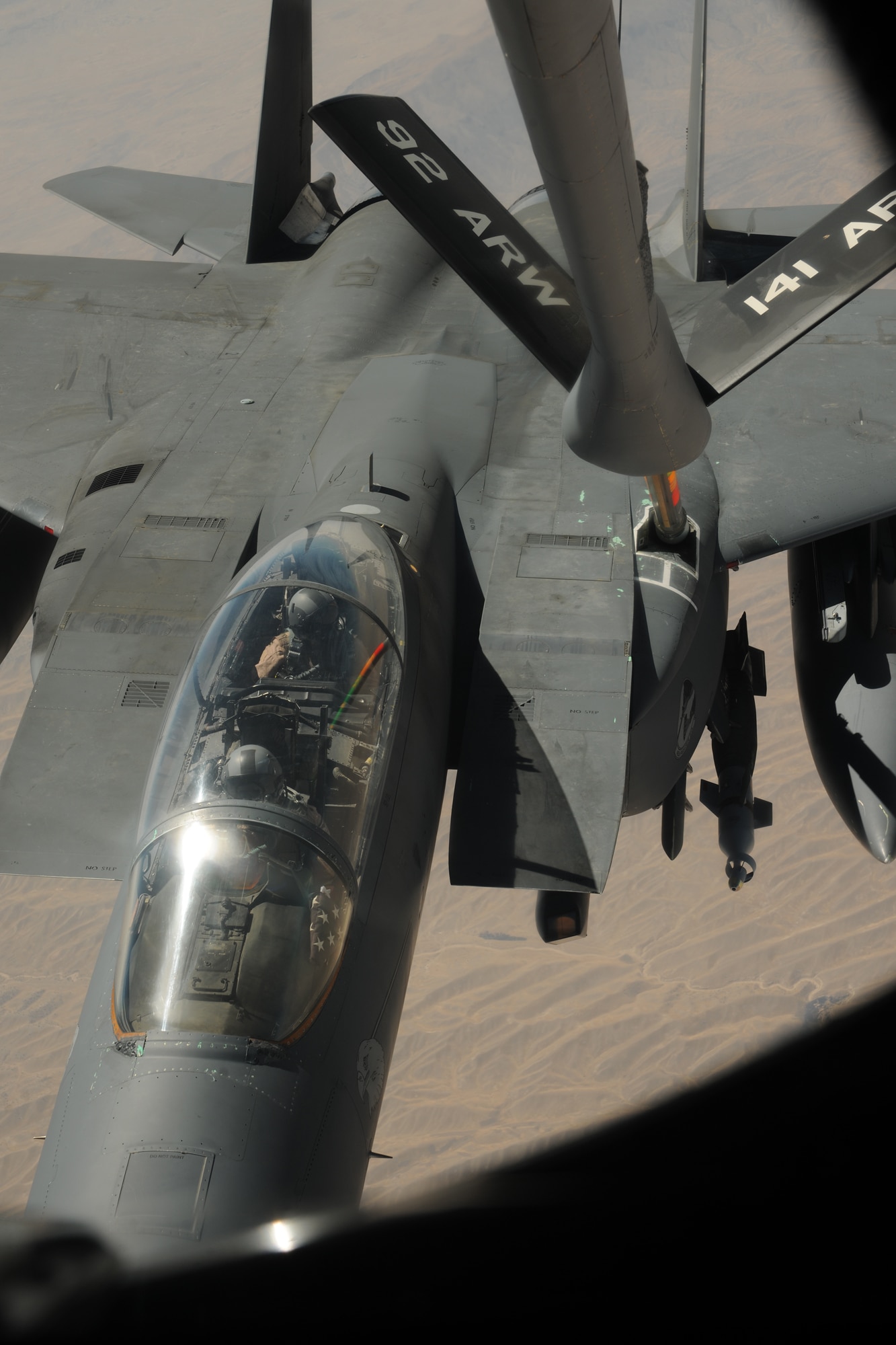 TRANSIT CENTER AT MANAS, Kyrgyzstan - A KC-135 Stratotanker transfers fuel over Afghanistan to an F-15E Strike Eagle belonging to the 492d Fighter Squadron from Royal Air Force Lakenheath, England Aug. 8.  The KC-135 is deployed from the 92d Air Refueling Wing from Fairchild Air Force Base, Washington.  (U.S. Air Force photo/Staff Sgt. Nathan Bevier)