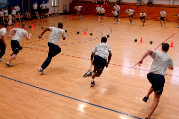 Dodge ball teams for the 628th Civil Engineer Squadron and 628th Medical Group face off during the Commander?s Fitness Challenge dodgeball game on Aug. 6, 2010, at the Fitness and Sports Center on Joint Base Charleston, S.C. The tournament winner was the 628 CES. (U.S. Air Force photo/Senior Airman Nicole Mickle)
