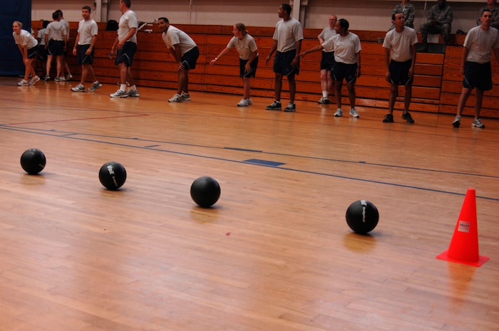 Members of the 628th Medical Group?s dodgeball team wait at the starting line during the Commander?s Fitness Challenge dodgeball game Aug. 6, 2010, at the Fitness and Sports Center on Joint Base Charleston, S.C. A total of 15 units from the base participated in the tournament. (U.S. Air Force photo/Senior Airman Nicole Mickle)