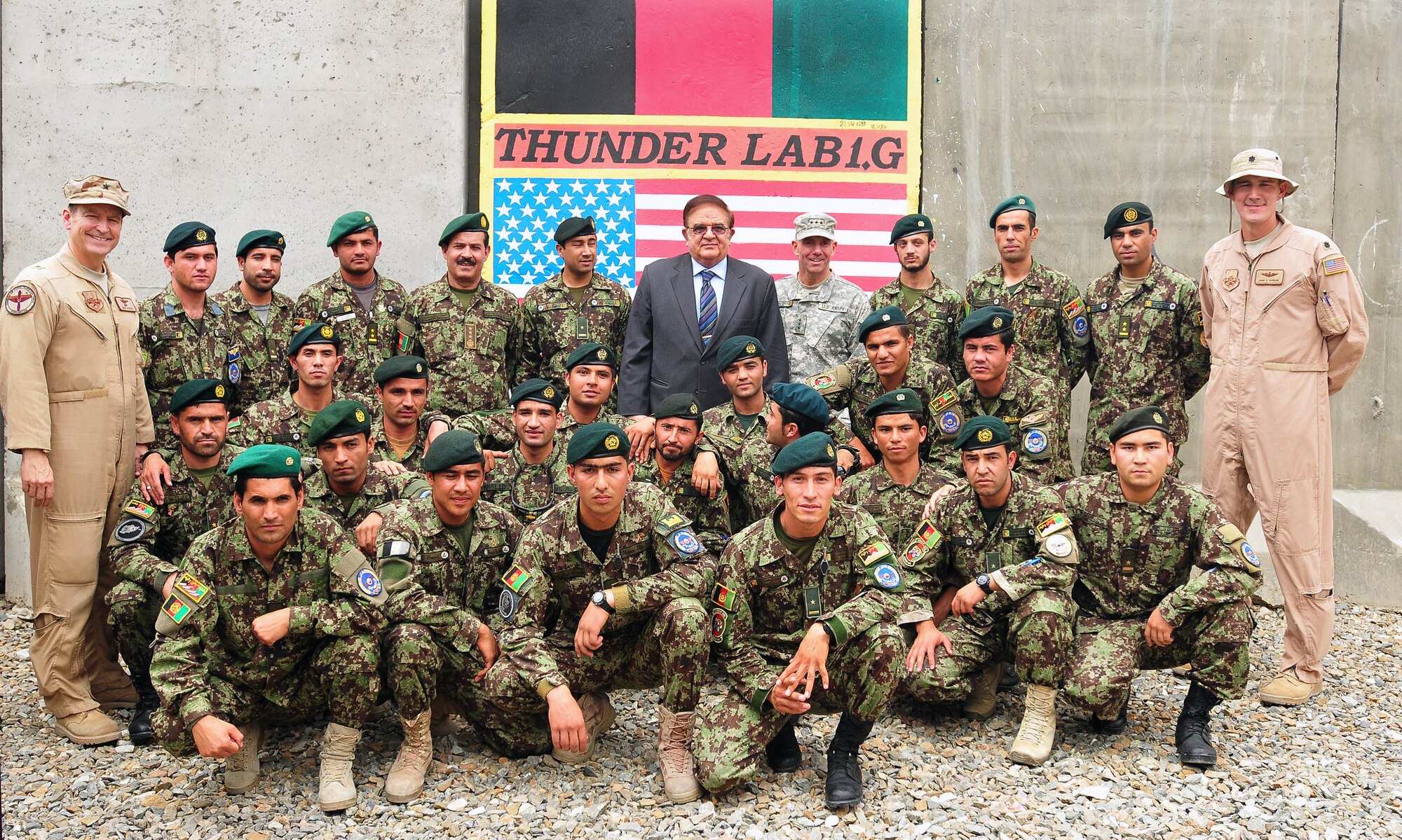 100810-N-6031Q-013 KABUL, Afghanistan -Brig. Gen. Michael Boera, Commanding General, 438th Air Expeditionary Wing, Combined Air Power Transition Force,left, with Ministry of Defense Abdul Rahim Wardak, center-left, Lt. Gen. William B. Caldwell, Commanding General, NATO Training Mission, Combined Security Transition Command Afghanistan, center-right, and Lt. Col. John Howard, 438th Air Expeditionary Wing, stand with the Afghan pilot candidates of the "Thunder Lab" at the Afghan Air Force base in Kabul, Afghanistan on Aug. 10, 2010. The "Thunder Lab" was created by the Combined Air Power Transition Force to provide Afghan pilot candidates an English immersion experience prior to their departure to the United States for pilot training with the goal of lowering the "culture shock" and improve performance. (US Navy photo by Mass Communication Specialist 2nd Class David Quillen/ RELEASED).