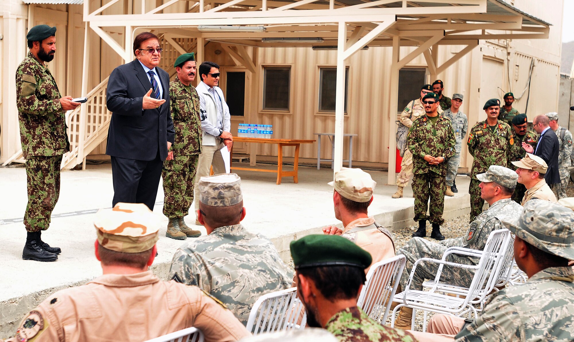 100810-N-6031Q-009 KABUL, Afghanistan - Ministry of Defense Abdul Rahim Wardak,with Gen. Muhammad Darwan, Commanding General, Kabul Air Wing, standing to his right, talks to Lt. Gen. William B. Caldwell, Commanding General, NATO Training Mission, Combined Security Transition Command - Afghanistan and a crowd of Airmen from both the U.S. and Afghan Air Force during an award presentation, held at the Afghan Air Force base in Kabul, Afghanistan on Aug. 10, 2010. The award presentation was in recognition of U.S. Air Force Airmen who have had a significant impact on the CAPTF mission in Afghanistan over the last several months. (US Navy photo by Mass Communication Specialist 2nd Class David Quillen/ RELEASED).
