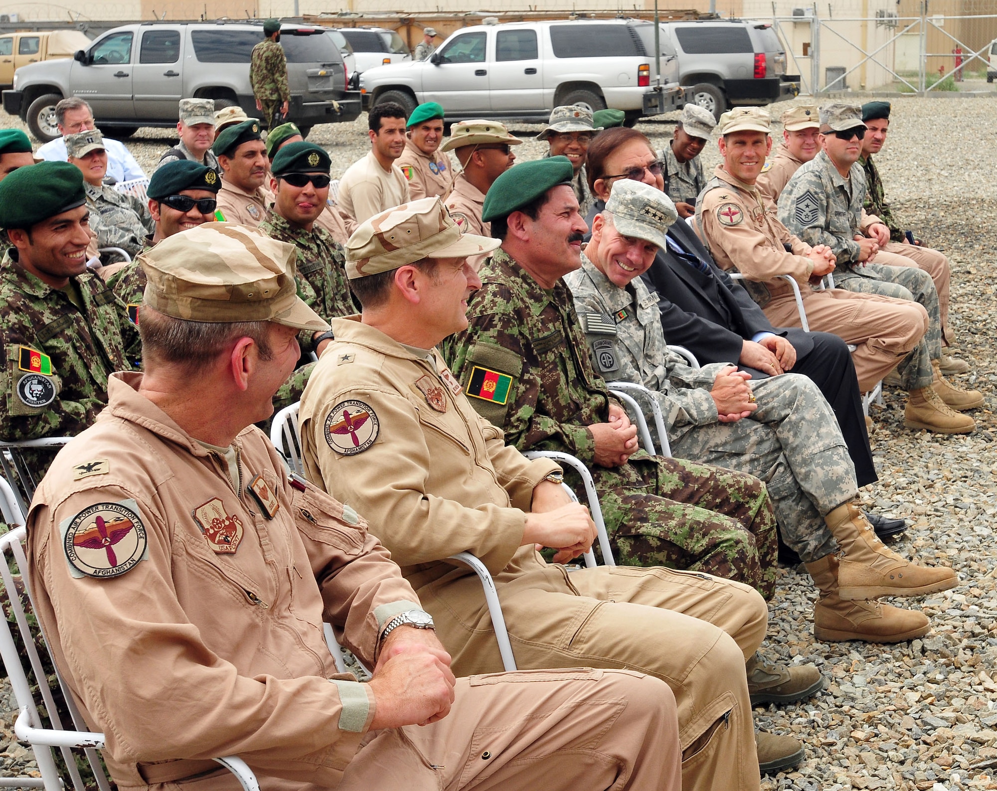 100810-N-6031Q-001 KABUL, Afghanistan - Lt. Gen. William B. Caldwell, Commanding General, NATO Training Mission, Combined Security Transition Command - Afghanistan, center, shares a laugh with Col. Greg Rice, 438th Air Expeditionary Wing, left, Brig. Gen. Michael Boera, Commanding General, 438th Air Expeditionary Wing, Combined Air Power Transition Force, and Gen. Muhammad Darwan, Commanding General, Kabul Air Wing, before an award presentation held at the Afghan Air Force base in Kabul, Afghanistan on Aug. 10, 2010. The award presentation was in recognition of U.S. Air Force Airmen who have had a significant impact on the CAPTF mission in Afghanistan over the last several months. (US Navy photo by Mass Communication Specialist 2nd Class David Quillen/ RELEASED).