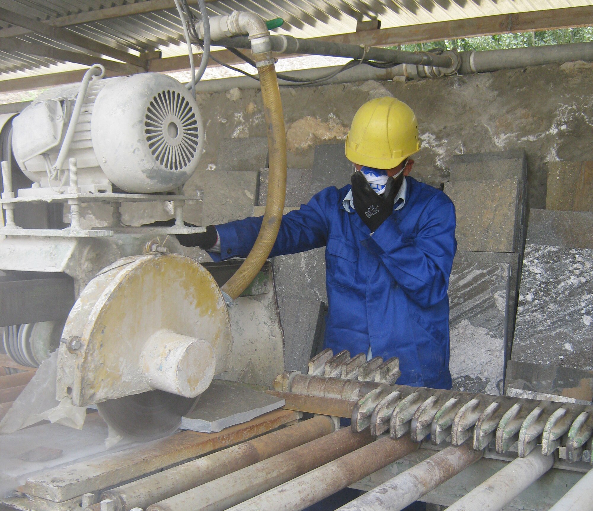 100809-F-1110S-013: A worker at the Ghulam Nabi Yaqoobi Construction and Road Construction Company processes raw marble. GNYCRC owners are looking to expand their marble company. The owners have an international business plan, and are looking for outside investors for the only legitimate marble mining operation in the Panjshir Province, Afghanistan. (Photo by U.S. Air Force 2nd Lt. Jason Smith, PRT Panjshir Public Affairs)