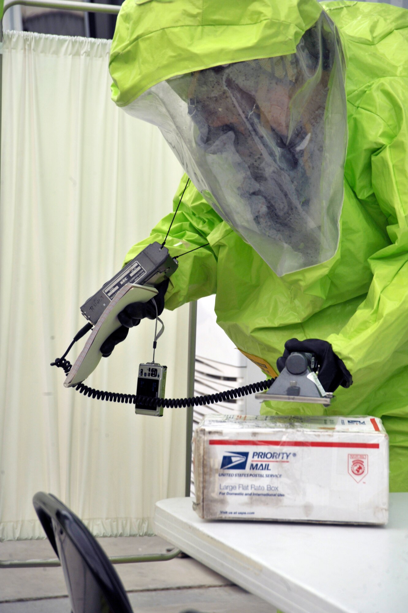 Airman 1st Class Tyler Aldrich, 380th Civil Engineer Squadron emergency management journeymen, tests a suspicious package for radiation during a hazardous response exercise at an undisclosed location in Southwest Asia Aug 7. (U.S. Air Force Photo/Tech. Sgt. April Wickes) 