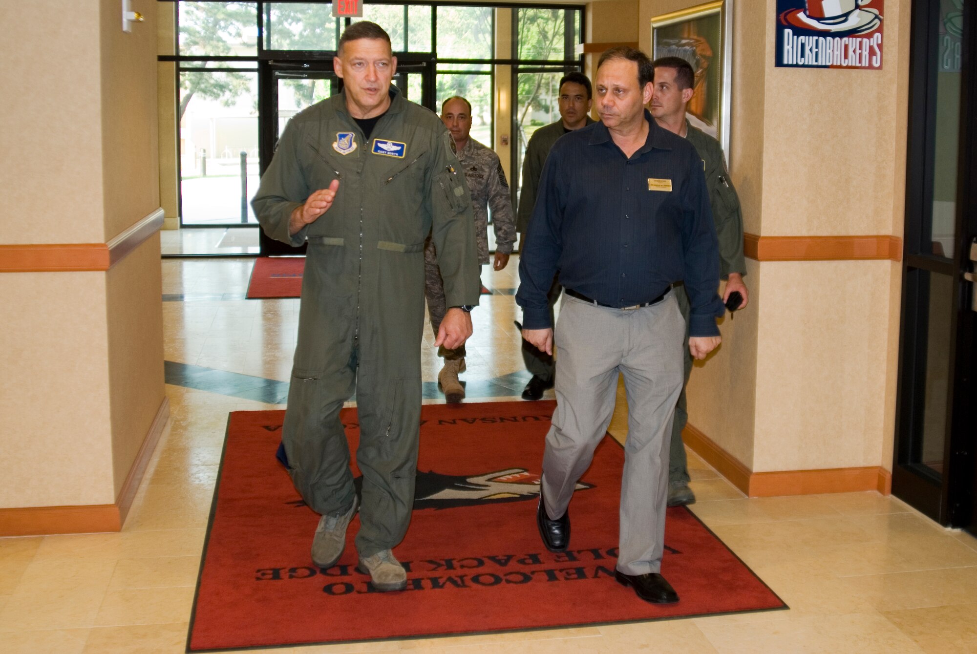 KUNSAN AIR BASE, Republic of Korea -- Gen. Gary North, Pacific Air Forces commander, discusses the improvements made to base lodging here with Samuel Sansone, 8th Force Support Squadron lodging manager, Aug. 8 during a visit to the base Aug. 8-10.  General North visited several areas of the base during his stay including the base exchange, bowling alley and fitness center. He also attended a dinner with Wolf Pack first sergeants and chiefs. (U.S. Air Force photo/Staff Sgt. Jonathan Pomeroy)
