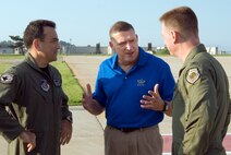KUNSAN AIR BASE, Republic of Korea -- Gen. Gary North, Pacific Air Forces commander, meets with Col. John Dolan, 8th Fighter Wing commander (right), and Col. Hugh Hanlon, 8th FW vice commander, after arriving on base Aug. 8 for a visit Aug. 8-10. General North visited several areas of the base during his stay including the base exchange, bowling alley, fitness center and lodging. He also attended a dinner with Wolf Pack first sergeants and chiefs. (U.S. Air Force photo/Staff Sgt. Jonathan Pomeroy)