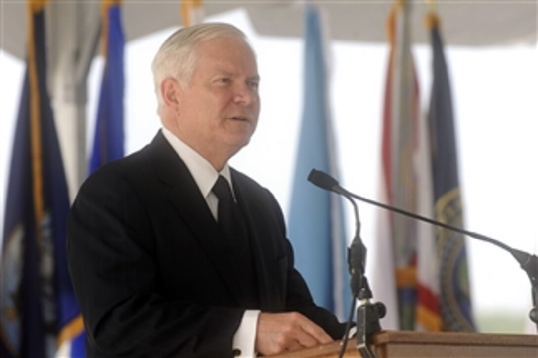 Secretary of Defense Robert M. Gates addresses the audience during the National Geospatial-Intelligence Agency change of directorship ceremony at the agency's new east campus in Springfield, Va., on Aug. 9, 2010.  Vice Adm. Robert B. Murrett relinquished command to Letitia Long.  Long is the first female to head a U.S. Intelligence agency.  