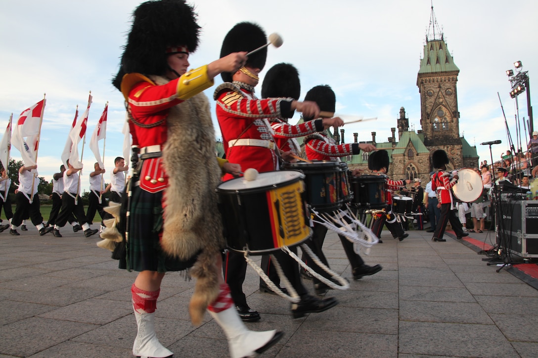 Drummers of the Canadian Forces Ceremonial Guard march past spectators on Parliament Hill during the 13th annual Fortissimo in Ottawa, Canada, Aug. 12. Members of the Ceremonial Guard performed alongside the 2nd Marine Aircraft Wing Band for four consecutive nights of the Fortissimo.