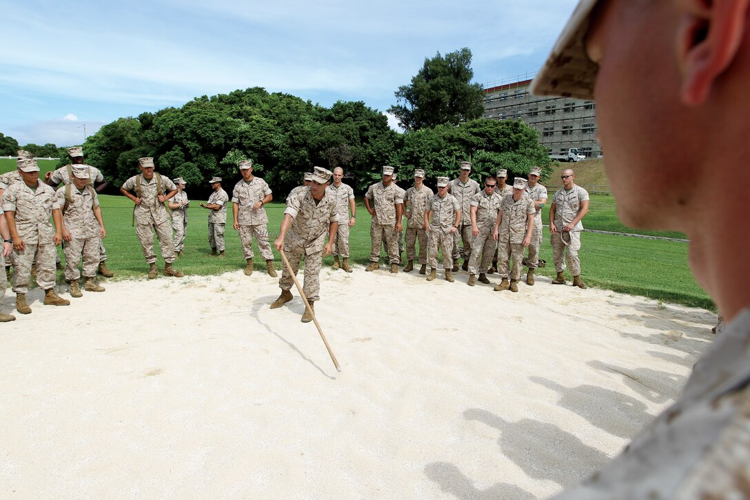 Marines from 12th Marine Regiment, 3rd Marine Division, III Marine Expeditionary Force, listen to Sgt. Yousef Badou, an instructor with Mobilization Training Battalion, School of Infantry West, Camp Pendleton, Calif., as part of pre-deployment training Aug. 11.