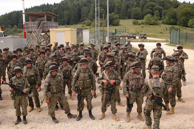 Soldiers with the Republic of Georgia's 32nd Light Infantry Battalion receive their orders prior to a cordon search of a simulated Afghanistan village during the situational training exercise at the Joint Multinational Readiness Center here. The 32nd Light Infantry Battalion is the second of four battalions to undergo training through the Georgia Deployment Program, a Marine Corps-led initiative designed to prepare the Georgians for their upcoming Afghanistan deployment in support of International Security Assistance Forces there.