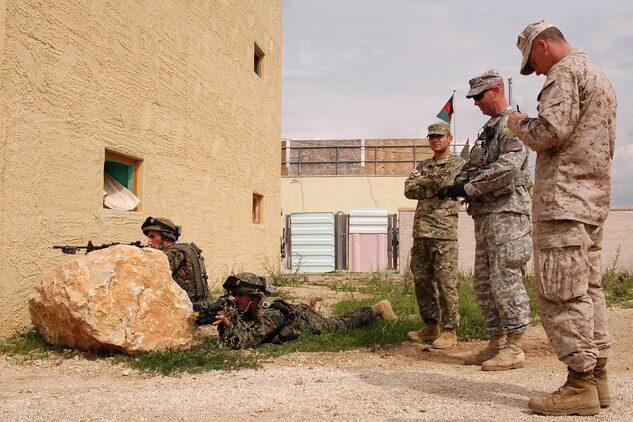 Observer/controllers with the Army and the Marine Corps, along with Georgian Military instructors serving as O/Cs,  work together to assess the Georgian soldiers during the situational training exercise at the Joint Multinational Readiness Center here. The Republic of Georgia's 32nd Light Infantry Battalion is the second of four battalions to undergo training through the Georgia Deployment Program, a Marine Corps-led initiative designed to prepare the Georgians for their upcoming Afghanistan deployment in support of International Security Assistance Forces there.