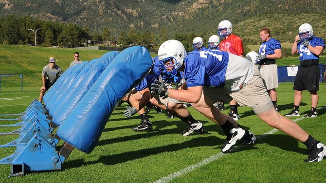 Falcons offensive linemen build their strength and endurance during practice at the Air Force Academy Athletic Fields Aug. 3, 2010. The previous season's offensive lineman graduated in May, but Air Force football head coach Troy Calhoun said he is confident in the new line's motivation and expertise. (U.S. Air Force photo/Rachel Boettcher)